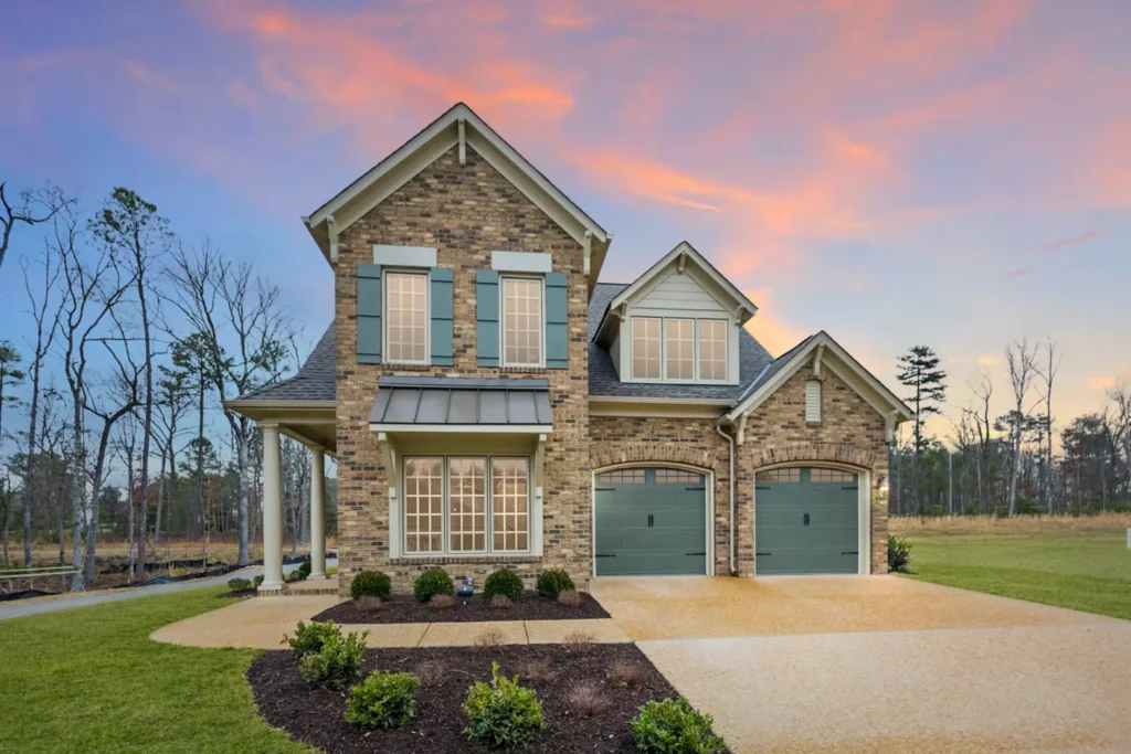 Front exterior of brick home at desk by Boone Homes