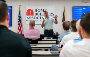 CBUSA president Brian Pavlick speaking to a room of builders