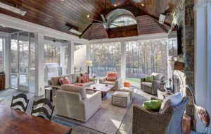 A living room with large floor to ceiling windows