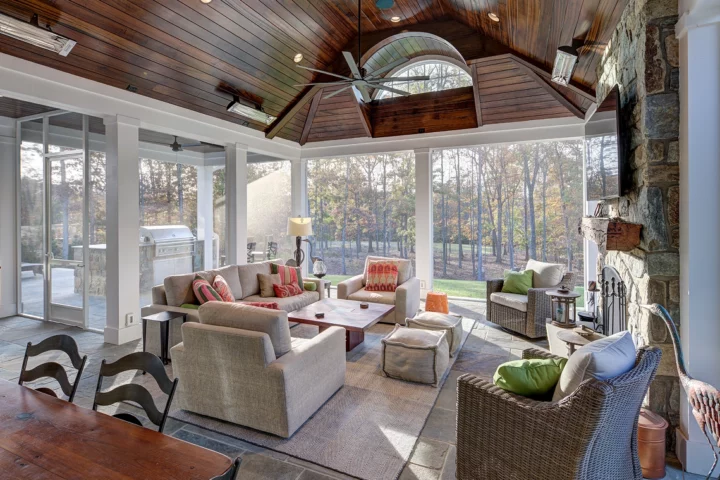 A living room with large floor to ceiling windows