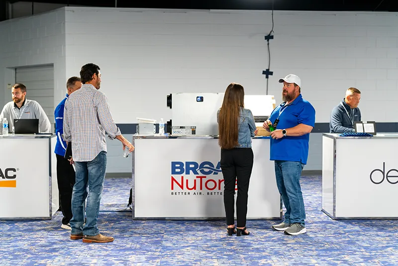 Group of people visiting and speaking to people at booths
