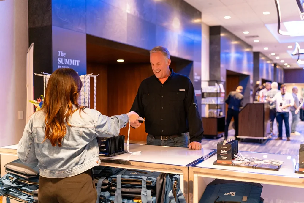 Man and woman exchanging information across a counter