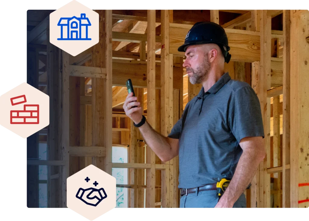 Man looking at phone while at a construction site