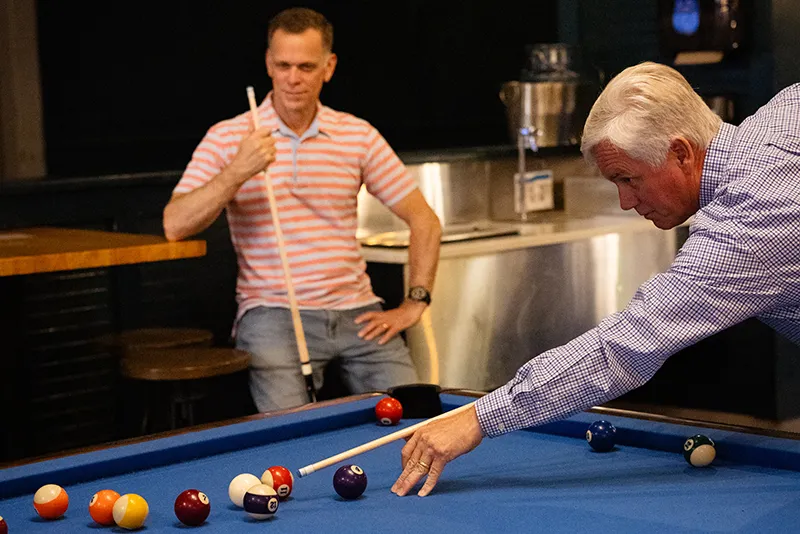 Two men playing billards