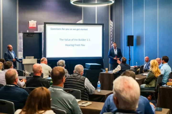Two men presenting to a group