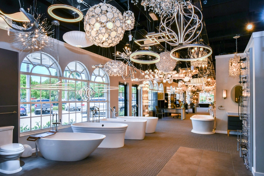 Ferguson showroom displaying freestanding bathtubs, bathroom fixtures and a variety of decorative lighting options.